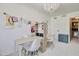 Bright bedroom featuring a decorative chandelier and ample room for a creative workspace at 1712 E Fairfield St, Mesa, AZ 85203