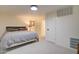 Bedroom with a gray upholstered bed and neutral colored walls and trim at 1712 E Fairfield St, Mesa, AZ 85203