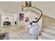 Grand foyer with a curved staircase, hardwood floors, and a view of the living spaces at 1712 E Fairfield St, Mesa, AZ 85203