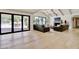 Bright living room with high ceilings, fireplace, access to back yard and natural light at 1712 E Fairfield St, Mesa, AZ 85203