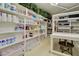 Walk-in pantry provides plentiful white shelves and countertop space for organized storage at 1712 E Fairfield St, Mesa, AZ 85203