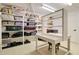 Spacious pantry equipped with shelving and a desk for storage and organization at 1712 E Fairfield St, Mesa, AZ 85203