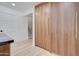 View of a modern pantry with floor-to-ceiling wood cabinetry and a glimpse of the staircase at 1712 E Fairfield St, Mesa, AZ 85203