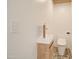 Chic powder room featuring mosaic tile floors, modern sink with gold faucet, and stylish toilet at 1712 E Fairfield St, Mesa, AZ 85203