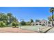 A tennis court and spacious lawn create an inviting outdoor space for recreation at 1712 E Fairfield St, Mesa, AZ 85203