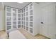 A walk-in closet with built-in shelving and drawers and an organized storage space at 1712 E Fairfield St, Mesa, AZ 85203