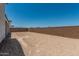 Large backyard with a brick wall at 17322 W Puget Ave, Waddell, AZ 85355