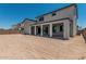 Backyard with covered patio area on a sunny day at 17322 W Puget Ave, Waddell, AZ 85355
