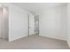 Bedroom featuring neutral walls and carpet with an open doorway at 17322 W Puget Ave, Waddell, AZ 85355