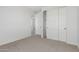 Bedroom featuring neutral walls, closet, and carpet at 17322 W Puget Ave, Waddell, AZ 85355