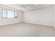 Spacious bedroom with a large window and neutral carpet at 17322 W Puget Ave, Waddell, AZ 85355
