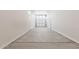 Spacious garage with a concrete floor and white walls at 17322 W Puget Ave, Waddell, AZ 85355