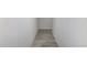 Hallway featuring wood look tile floors and neutral walls at 17322 W Puget Ave, Waddell, AZ 85355