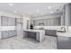 Modern kitchen features gray cabinets, white countertops and backsplash, and a center island at 17322 W Puget Ave, Waddell, AZ 85355