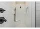 Shower features modern fixtures, white tile, and glass enclosure at 17322 W Puget Ave, Waddell, AZ 85355