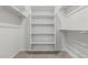 Walk-in closet featuring multiple levels of shelving for optimal storage and organization at 17322 W Puget Ave, Waddell, AZ 85355