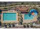 Aerial view of the community pools, splash pad, and well-maintained landscaping at 1799 N 209Th Ave, Buckeye, AZ 85396