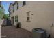Spacious backyard with gravel landscaping and an air conditioning unit at 1799 N 209Th Ave, Buckeye, AZ 85396