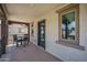 Spacious balcony with dark table and chairs overlooking a neighborhood at 1799 N 209Th Ave, Buckeye, AZ 85396