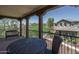 Balcony featuring a dark-colored table and chairs with neighborhood views at 1799 N 209Th Ave, Buckeye, AZ 85396