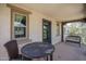 Cozy balcony with dark wicker furniture and textured stucco exterior at 1799 N 209Th Ave, Buckeye, AZ 85396