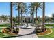 Impressive community entrance with a fountain, lush landscaping, and a welcoming atmosphere at 1799 N 209Th Ave, Buckeye, AZ 85396