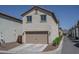 Detached two-car garage featuring a neutral color scheme, complementing the neighborhood's design at 1799 N 209Th Ave, Buckeye, AZ 85396