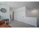 Upstairs hallway with white walls and carpets featuring white doors and trim at 1799 N 209Th Ave, Buckeye, AZ 85396