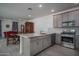 Modern kitchen seamlessly connected to the living room, perfect for entertaining and casual Gathering meals at 1799 N 209Th Ave, Buckeye, AZ 85396