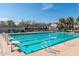 Community lap pool perfect for exercise, with clear blue water, starting blocks, and marked lanes at 1799 N 209Th Ave, Buckeye, AZ 85396