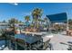 Inviting outdoor dining and seating area with a fire pit, perfect for entertaining guests and enjoying community life at 1799 N 209Th Ave, Buckeye, AZ 85396