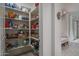 Well-organized pantry offering ample storage for groceries and household essentials to keep your kitchen clutter-free at 1799 N 209Th Ave, Buckeye, AZ 85396