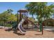 Fun playground featuring slides, climbing structures, and a safe, cushioned play area for children at 1799 N 209Th Ave, Buckeye, AZ 85396