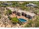 Luxurious desert property featuring a pool and architectural details surrounded by native landscaping, an inviting outdoor retreat at 2304 Fox Tail Trl, Carefree, AZ 85377