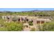 Expansive neutral home with desert landscaping, mountain views, and a three-car garage at 2304 Fox Tail Trl, Carefree, AZ 85377
