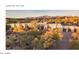 Desert estate featuring architectural details, mature landscaping, and mountain views, epitomizing luxury living at 2304 Fox Tail Trl, Carefree, AZ 85377