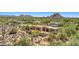 Elegant desert home showcasing architecture blending with natural desert landscape, offering a serene oasis at 2304 Fox Tail Trl, Carefree, AZ 85377