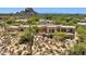Desert house with architectural design surrounded by natural desert landscape, epitomizing privacy and serenity at 2304 Fox Tail Trl, Carefree, AZ 85377