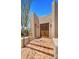 Close-up of the front entry showcasing the double wooden doors and brick steps at 2304 Fox Tail Trl, Carefree, AZ 85377
