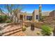 Neutral stucco home with a brick paver entrance, steps, and desert landscaping at 2304 Fox Tail Trl, Carefree, AZ 85377