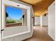 Hallway featuring wood beamed ceilings and a built-in bench at 2304 Fox Tail Trl, Carefree, AZ 85377