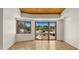 Bright living room with hardwood floors, and a sliding glass door to the patio at 2304 Fox Tail Trl, Carefree, AZ 85377
