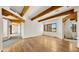 Open living area features wood floors and exposed beams at 2304 Fox Tail Trl, Carefree, AZ 85377