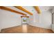 Open living area features wood floors and exposed beams at 2304 Fox Tail Trl, Carefree, AZ 85377