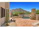 A private pool and patio, desert landscaping, and a mountain view at 2304 Fox Tail Trl, Carefree, AZ 85377