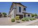 Charming two-story home has desert landscaping and an open parking area at 2540 N 148Th Dr, Goodyear, AZ 85395