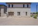 Charming stucco two-story home featuring a one-car garage and desert landscaping at 2540 N 148Th Dr, Goodyear, AZ 85395