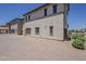 Exterior view showcasing the home's architecture, three-car garage, and well-maintained grounds at 2540 N 148Th Dr, Goodyear, AZ 85395