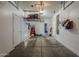 Functional garage with ample storage shelving and access to the home's interior at 2540 N 148Th Dr, Goodyear, AZ 85395
