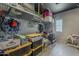 Cluttered garage offers overhead storage racks and space for household items at 2540 N 148Th Dr, Goodyear, AZ 85395